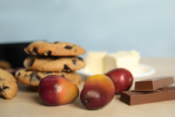 Palm oil fruits and sweets on wooden table
