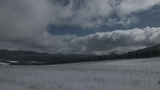 Epic clouds over the mountains time lapse