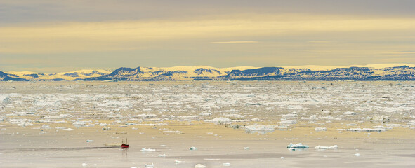 Panoramic shot of a boat on the Disko Bay