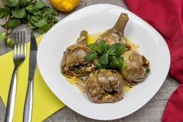 Roman-style artichokes with mint. Traditional Italian cuisine dish. Artichokes alla Romana.