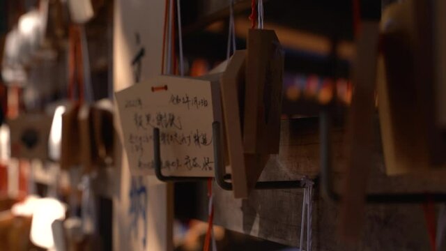 Beautiful mysterious wooden wishing cards at typical Japanese shrine close up
