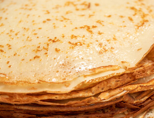 Close-up of a stack of freshly baked pancakes. Selective focus.