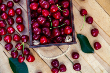 Ripe cherries in a wooden box.