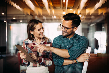 Group of business people and software developers working as a team in office
