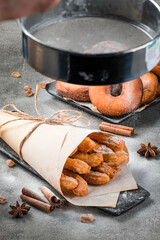 Traditional churros sticks with cinnamon sprinkling with sugar powder