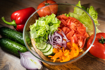 Salad with fresh summer vegetables, top view