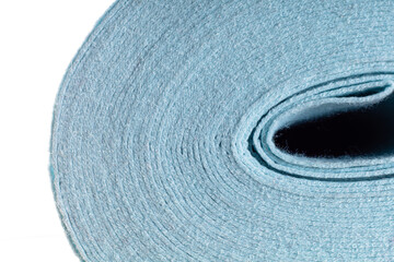a roll of light blue dense fabric on a white background, side view, close-up, background, texture