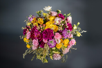 Close up wedding bouquet of flowers Isolated on a gray background. Delicate bouquet in pastel colors. Summer flowers