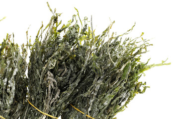 dried, chopped, green seaweed on white background 