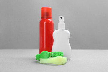 Set of different insect repellents on grey background