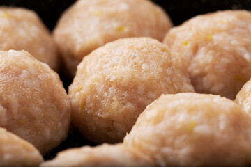 Raw meatballs closeup. Home cooking concept, top view