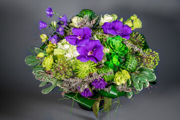 Close up wedding bouquet of flowers Isolated on a gray background. Delicate bouquet in pastel colors. Summer flowers