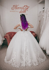 Obraz premium beautiful bride with purple hair picks up her wedding dress, wedding, bride, dress, white, bridal, marriage, woman, love, beautiful, lace, hands, fashion, gown, celebration, beauty, veil, hand, silk, 