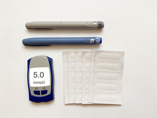 Insulin short, long, glucose meter and test strips on a white isolated background. Set for...