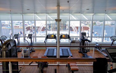 Fitness Center or gym onboard luxury cruiseship or cruise ship liner with modern cardio and free...