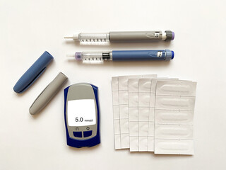 Insulin short, long, glucose meter and test strips on a white isolated background. Set for...