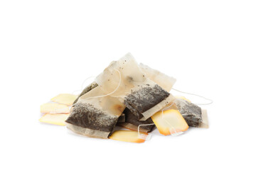 Many used tea bags on white background