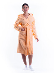 woman in a Bathrobe on an isolated white background with a smile on her face.