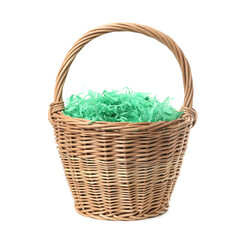 Fototapeta na wymiar Easter basket with green paper filler isolated on white
