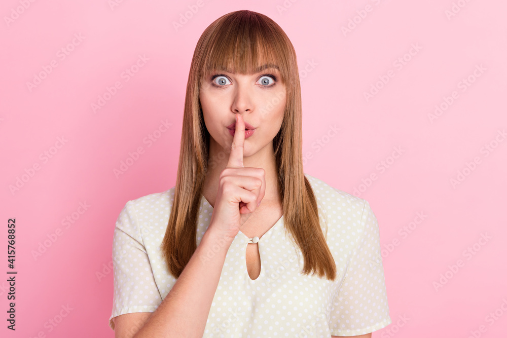 Poster Portrait of attractive funny mysterious girl showing shh sign keep silence isolated over pink pastel color background