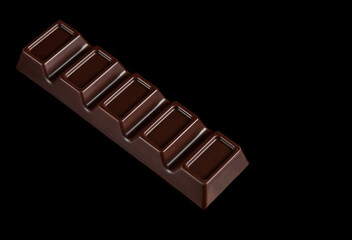 Dark chocolate bar on black isolated background. Sweet popular product. Top View