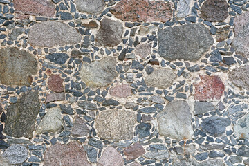 Fragment of a stone wall.