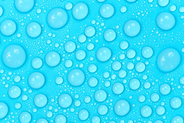 Water drops on blue background texture. Backdrop glass covered with drops of water. bubbles in water
