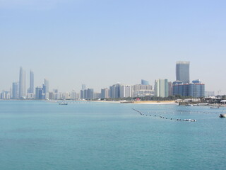 Fototapeta premium beach and sea with tall buildings