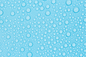 Water drops on blue background texture. Backdrop glass covered with drops of water. bubbles in water