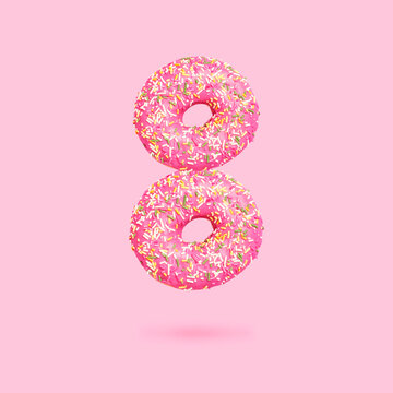 Number 8 from sweet pink donuts on pink background. Creative concept of 8 March holiday. International women's day symbol. Food, donut with multi-colored powder and pink icing. Spring, holiday, art