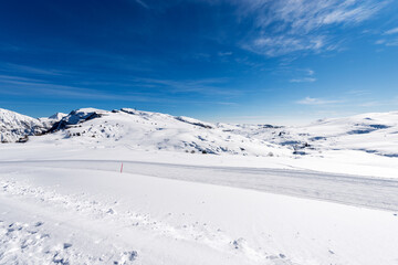 Fototapeta na wymiar Peak of Malga San Giorgio, Ski Resort in winter with snow. Altopiano della Lessinia (Lessinia Plateau), Regional Natural Park, Verona province, Veneto, Italy, Europe. On the left the Monte Carega.