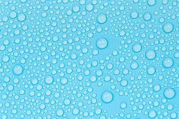 Water drops on blue background texture. Backdrop glass covered with drops of water. bubbles in water