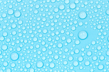 Water drops on blue background texture. Backdrop glass covered with drops of water. bubbles in water