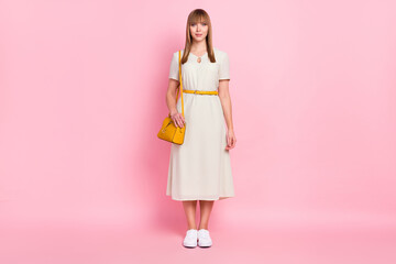 Full length body size view of nice attractive girl wearing long white dress isolated over pink pastel color background