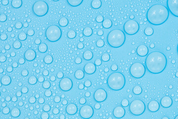Water drops on blue background texture. Backdrop glass covered with drops of water. bubbles in water