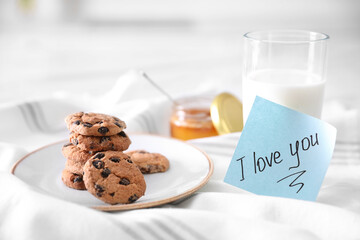 Romantic breakfast with note saying I Love You on table