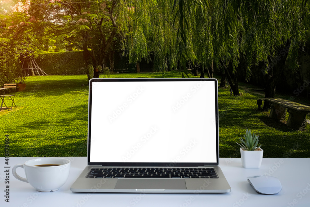 Aufkleber front view of open laptop computer notebook with blank monitor white screen display on work table de
