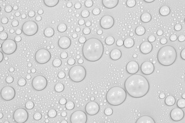 Water drops on white background texture. backdrop glass covered with drops of water.  bubbles in water