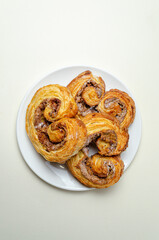 French sweet bun. On a white plate High quality photo
