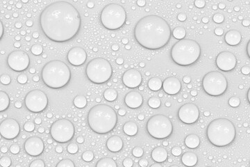 Water drops on white background texture. backdrop glass covered with drops of water.  bubbles in water