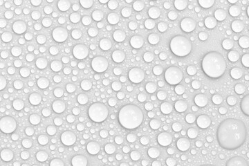 Water drops on white background texture. backdrop glass covered with drops of water.  bubbles in water