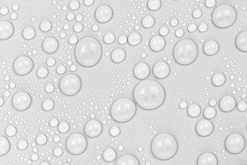 Water drops on white background texture. backdrop glass covered with drops of water.  bubbles in water