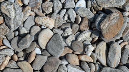 Big and small flat stones. Wallpaper or background. Earth day concept. 