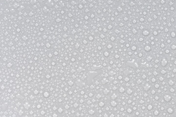 Water drops on white background texture. backdrop glass covered with drops of water.  bubbles in water