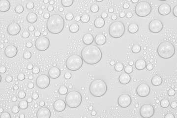 Water drops on white background texture. backdrop glass covered with drops of water.  bubbles in water