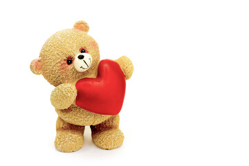 teddy bear holding a heart on a white background