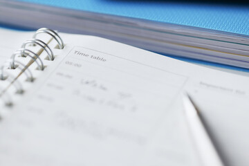 Closeup of notebook with to do list and pen