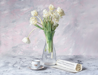 Delicate light spring still life with a bouquet of white tulips in a vase. Vase with white tulips and a cup of coffee on a light background.