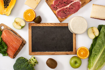 Vitamin A in food and blackboard mockup isolated on white background