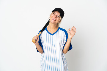 Young Russian woman playing baseball isolated on white background saluting with hand with happy expression